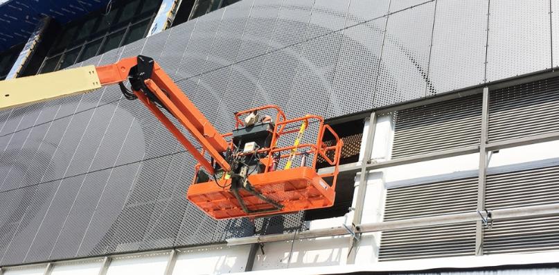 contractors installing perforated panels