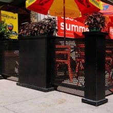 black perforated metal fence