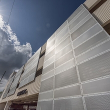 Perforated metal attached to a parking garage