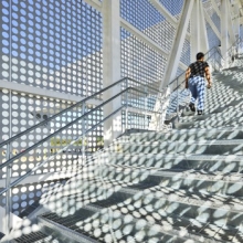 Perforated Metal Shadows On A Staircase