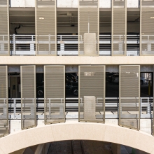 Multiple perforated metal panels on a parking garage
