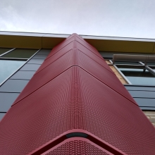 Perforated Radius Forming Facade