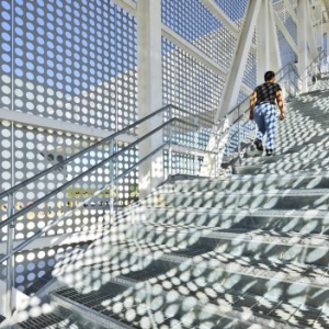 Perforated Metal Shadows On A Staircase